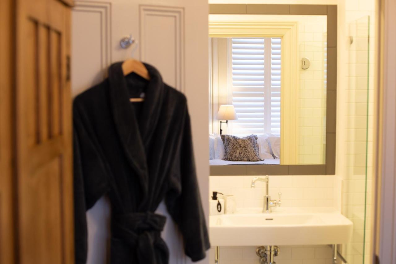 The Rivulet Bed & Breakfast Sandy Bay Exterior photo A bathrobe hanging on a bathroom door