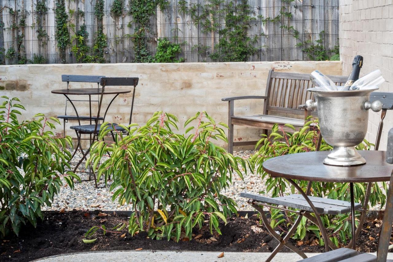 The Rivulet Bed & Breakfast Sandy Bay Exterior photo The garden at the hotel